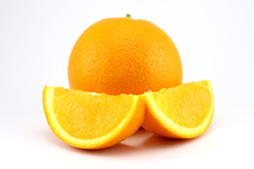 Orange fruit with slices isolated on white background.