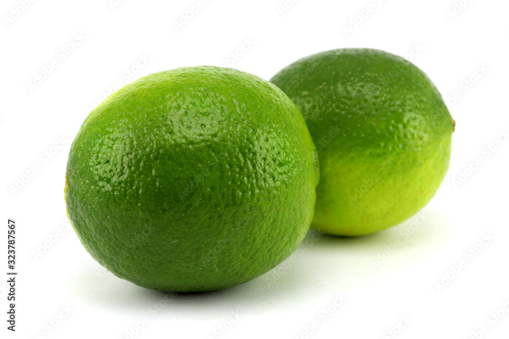 Wall mural Juicy lime isolated on white background.