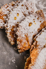 Fresh-baked waffles with powdered sugar and honey for breakfast