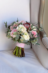 Wedding flowers, bridal bouquet closeup. Decoration made of roses, peonies and decorative plants, close-up, selective focus, nobody, objects