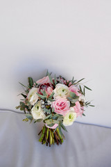 Wedding flowers, bridal bouquet closeup. Decoration made of roses, peonies and decorative plants, close-up, selective focus, nobody, objects. copy space