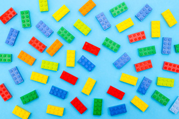 Plastic bricks for kids in different colors on the table