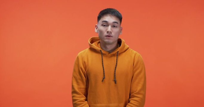 Young man rolling his eyes