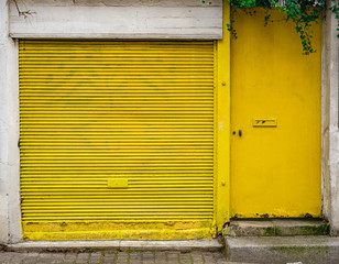 Yellow door in Paris, France - 323793352