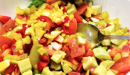 salad with tomato, zucchini, and pepper close-up