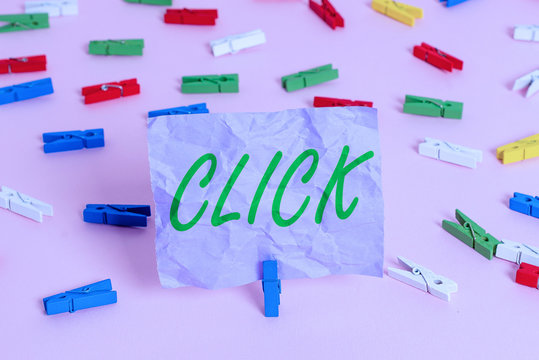 Word writing text Click. Business photo showcasing Act of pressing a button on a mouse similar device Sharp short sound Colored clothespin papers empty reminder pink floor background office pin - Powered by Adobe