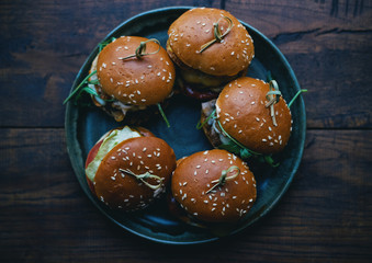 Five different american mini burgers in a plate fast food