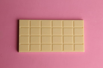 white chocolate tablet in color background