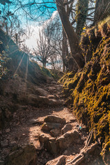 Mud ramps on the trail of Mount Adarra in Guipuzcoa with sunshine above. Basque Country