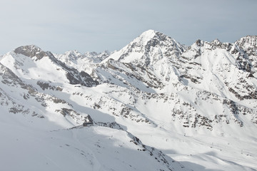 Fototapeta na wymiar Austrian Mountains in the Alps of Tyrol. Alpine Winter landscape and mountain panorama in Europe. Glacier Stubaier Gletscher Skiing area near Innsbruck. Perfect weather