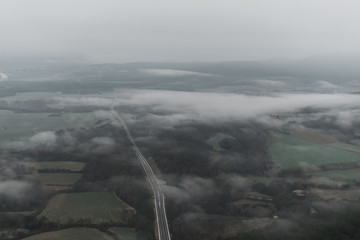 Image of a foggy road, from the air