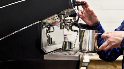 churning milk in a coffee machine