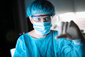 Scientist doctor in the laboratory examines the samples of the virus in vitro. vaccine development...