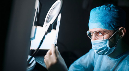 Scientist doctor in the laboratory examines the samples of the virus in vitro. vaccine development...