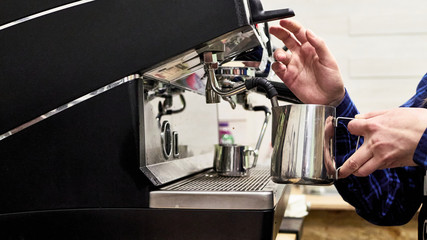 churning milk in a coffee machine