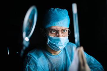 Scientist doctor in the laboratory examines the samples of the virus in vitro. vaccine development...