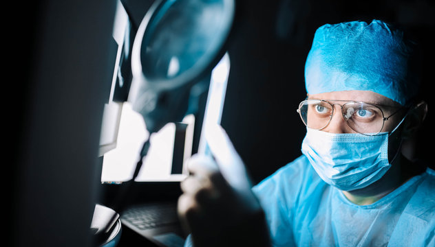 Scientist doctor in the laboratory examines the samples of the virus in vitro. vaccine development concept