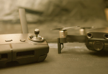 Remote controller and blurred copter in the background