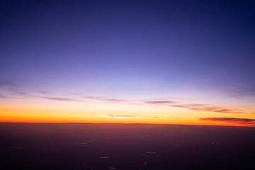 sunrise in the sky over the clouds