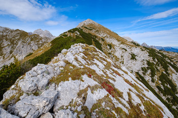 View to the top of Veliki Draski vrh with Triglav in background