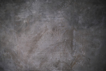 Abstract artistic background. Dark grey canvas backdrop with textured stains.