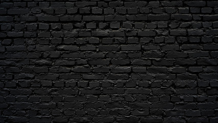 Black brick wall as background or wallpaper or texture
