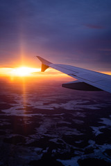 Fototapeta na wymiar wing view plane in the sky sunrise