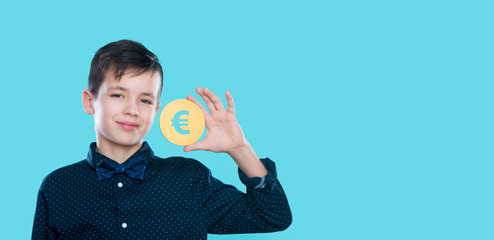 Child boy hold money sign in hands on blue background