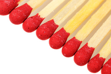 matches with a red head on a white background