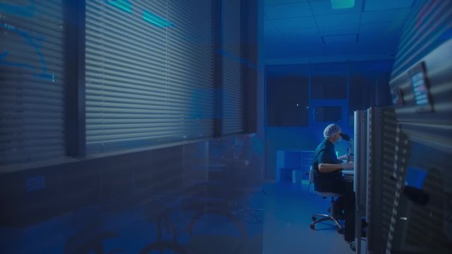 In a Modern Laboratory Scientist Conduct Experiments. The embryologist Examines Samples with a Microscope
