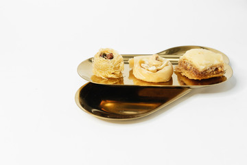 Baklava sweet dessert. Pastry made of layers of filo filled with chopped nuts and sweetened and held together with syrup or honey 