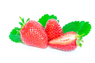 Fresh two whole strawberries with half cut and leaves isolated on a white