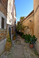 A narrow street between the old houses of a medieval village