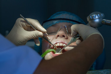 A child at the dentist's appointment. Dental treatment and brushing in the doctor’s office.