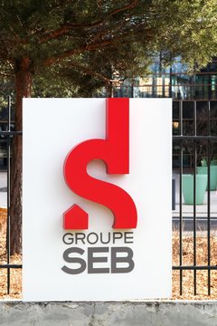 Ecully, France - February 26, 2017: Groupe SEB logo on a wall. Groupe SEB is a large French consortium that produces small appliances and Its headquarters are in Ecully, a Lyon suburb, France