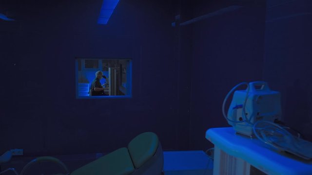 In a Modern Laboratory Scientist Conduct Experiments. The embryologist Examines Samples with a Microscope