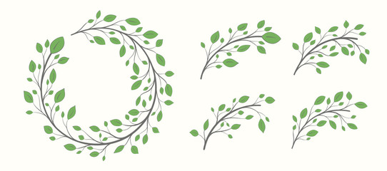 Frame of a branch with green leaves in the shape of a circle plus a set of branches with leaves