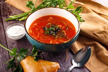 borsch-traditional Ukrainian cuisine red soup with beets, potatoes, meat, carrots, cabbage and garlic