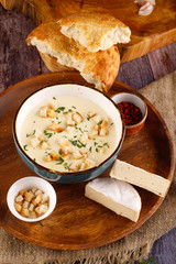 cream soup with parsley and mushrooms on the table