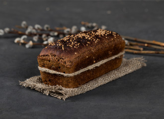Rye bread with cardamom in rustic style on a gray background