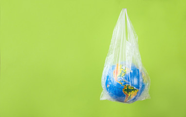 Earth planet in a plastic, eco no plastic concept, globe in plastic.