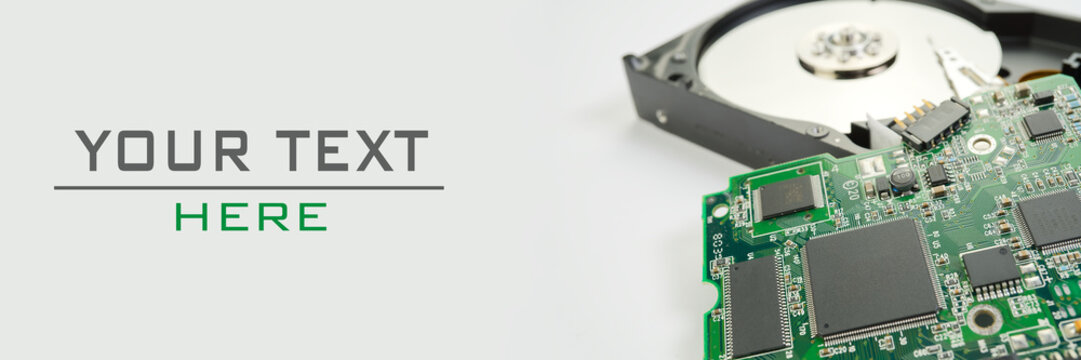 HDD. Inside of hard disk - magnetic disk with a reading head and motherboard. can be used as PC repairing concept. panoramic shootwith sample text