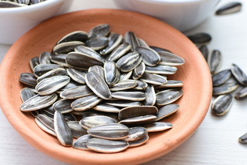 Helianthus annuus: Fresh sunflower seeds, with sunflower flower petals