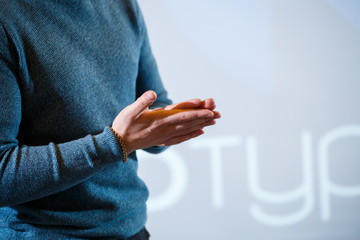 guy businessman at the conference tells information to people