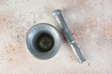 Fototapeta na wymiar Vintage aluminum mortar with pestle