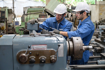 Fototapeta na wymiar Two Caucasian male worker engineer working in factory area line up.