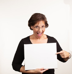 Woman holding up a blank white sign with room for your copy