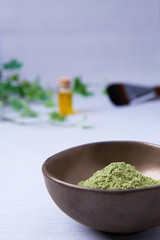 A bowl of the ayurvedic powder Sidr (Zizyphus jujuba) on a light background