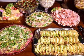 delicious Mexican tacos tortillas with meat salad and cheese served on the tray with occasional blurs