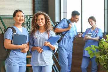 Group of medical students in corridor of modern clinic